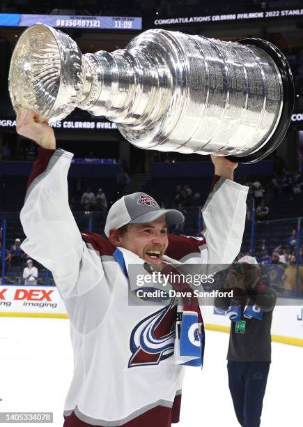 Artturi Lehkonen of the Colorado Avalanche hoists the Stanley Cup after the Colorado Avalanche defeated the Tampa Bay Lightning in Game Six of the...