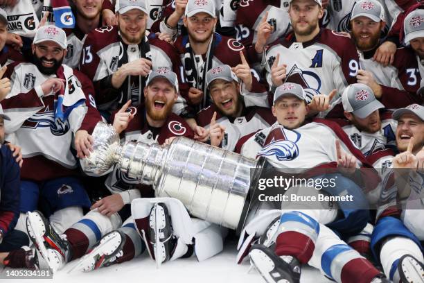 Colorado Avalanche coaches and players pose for a photo after defeating the Tampa Bay Lightning 2-1 in Game Six of the 2022 NHL Stanley Cup Final at...