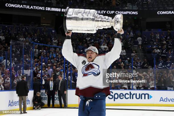Erik Johnson of the Colorado Avalanche lifts the Stanley Cup after defeating the Tampa Bay Lightning 2-1 in Game Six of the 2022 NHL Stanley Cup...
