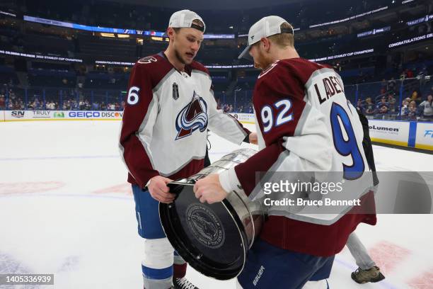 Gabriel Landeskog of the Colorado Avalanche passes the Stanley cup to Erik Johnson after defeating the Tampa Bay Lightning 2-1 in Game Six of the...