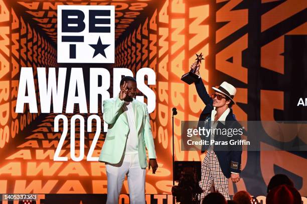 Mile and Bruno Mars of Silk Sonic accept Album of the Year for 'An Evening With Silk Sonic' onstage during the 2022 BET Awards at Microsoft Theater...