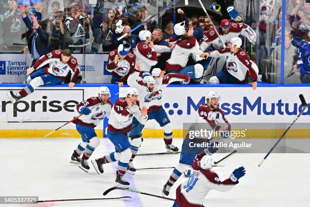 Colorado Avalanche players celebrate after defeating the Tampa Bay Lightning 2-1 in Game Six of the 2022 NHL Stanley Cup Final at Amalie Arena on...