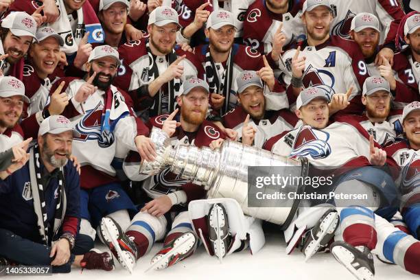 Colorado Avalanche coaches and players pose for a photo after defeating the Tampa Bay Lightning 2-1 in Game Six of the 2022 NHL Stanley Cup Final at...