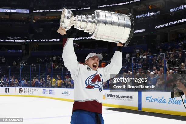 Nicolas Aube-Kubel of the Colorado Avalanche lifts the Stanley Cup after defeating the Tampa Bay Lightning 2-1 in Game Six of the 2022 NHL Stanley...