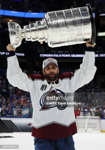 Andrew Cogliano of the Colorado Avalanche hoists the Stanley Cup after the Colorado Avalanche defeated the Tampa Bay Lightning in Game Six of the...