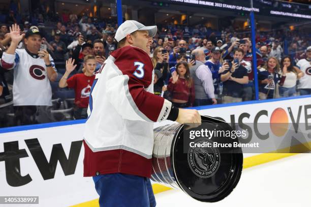 Jack Johnson of the Colorado Avalanche lifts the Stanley Cup after defeating the Tampa Bay Lightning 2-1 in Game Six of the 2022 NHL Stanley Cup...