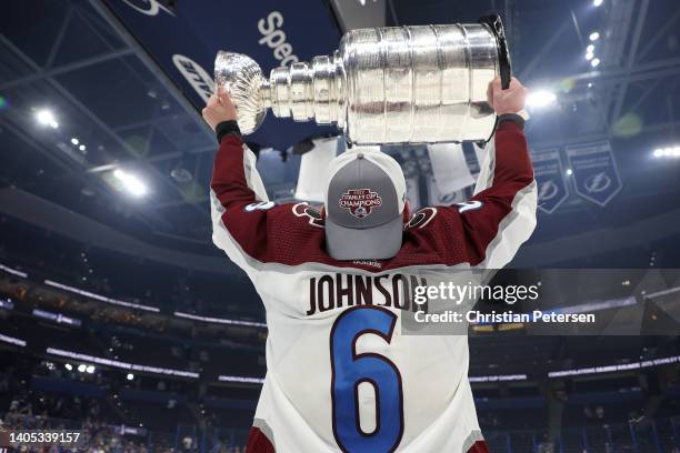 Erik Johnson of the Colorado Avalanche lifts the Stanley Cup after defeating the Tampa Bay Lightning 2-1 in Game Six of the 2022 NHL Stanley Cup...