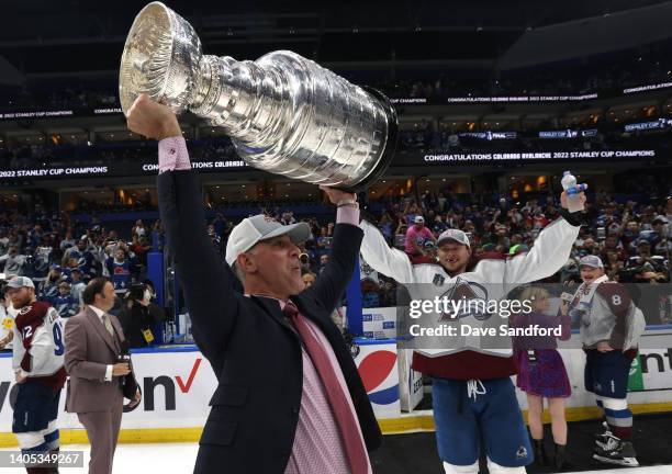 Head coach Jared Bednar of the Colorado Avalanche hoists the Stanley Cup after Game Six of the 2022 Stanley Cup Final at Amalie Arena on June 26,...