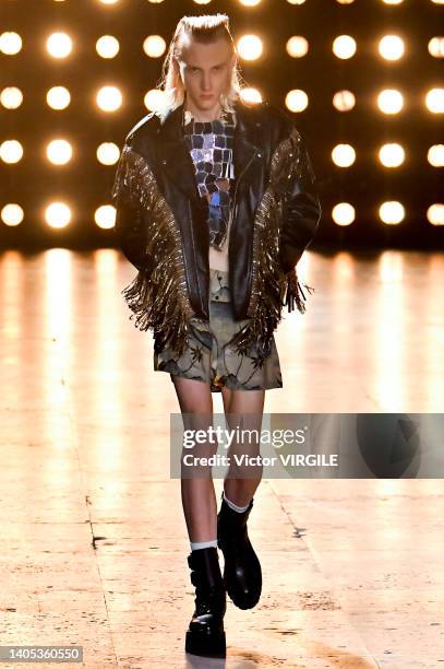 Model walks the runway during the Celine Ready to Wear Spring/Summer 2023 fashion show as part of the Paris Men Fashion Week on June 26, 2022 in...