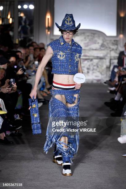 Model walks the runway during the Thom Browne Ready to Wear Spring/Summer 2023 fashion show as part of the Paris Men Fashion Week on June 26, 2022 in...