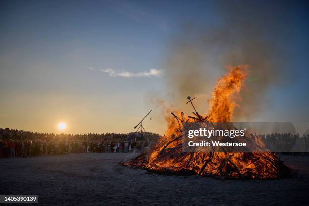 midsummer night at the beach in skagen with bonfire as symbol of long summer days - bonfire stock pictures, royalty-free photos & images