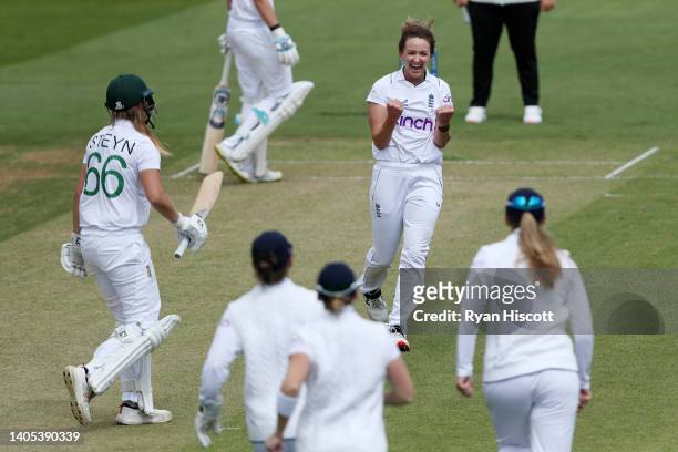 Kate Cross of England celebrates after bowling out Andrie Steyn of South Africa during Day One of the First Test Match between England Women and...