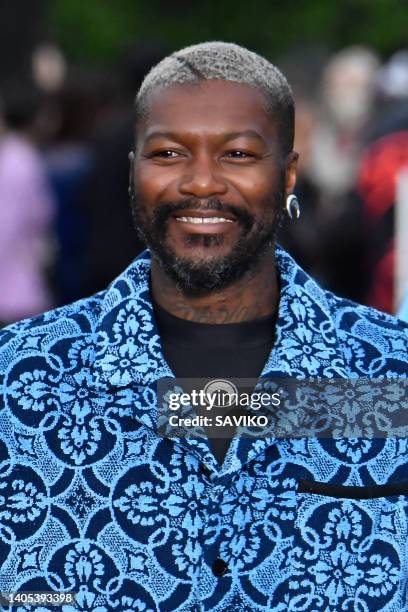 Footbaler Djibril Cissé walks the runway during the Marine Serre Ready to Wear Spring/Summer 2023 fashion show as part of the Paris Men Fashion Week...