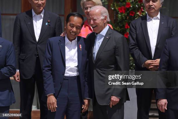 President Joe Biden and Indonesian President Joko Widodo chat prior to a group photo of the Outreach working session on the second day of the G7...