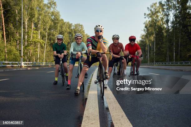 cycling club - small group of people stock pictures, royalty-free photos & images