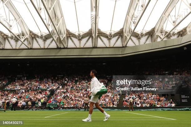 Novak Djokovic of Serbia enters Centre Court for their Men's Singles First Round match against Soonwoo Kwon of South Korea during Day One of The...