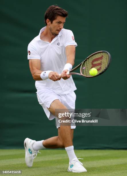 Aljaz Bedene of Slovenia plays a backhand against Maximilian Marterer of Germany during the Men's Singles First Round match during Day One of The...