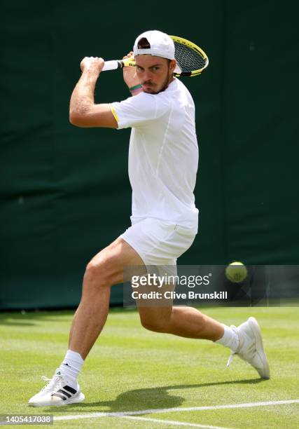 Maximilian Marterer of Germany plays a backhand against Aljaz Bedene of Slovenia during the Men's Singles First Round match during Day One of The...