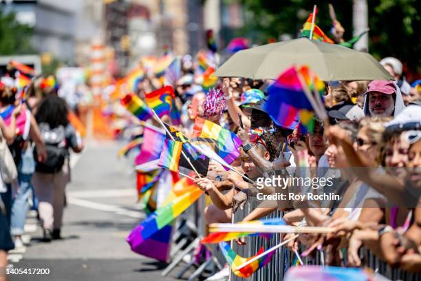 People in Pride colors attend and march during the 2022 New York City Pride March on June 26, 2022 in New York City.