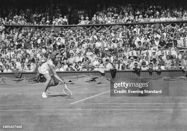 American tennis player Darlene Hard in action against Helga Schultze of West Germany in their Women's Singles third round match of the 1963 Wimbledon...