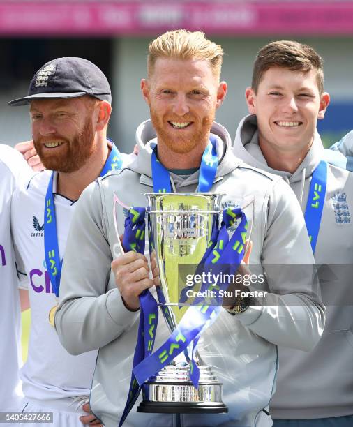 England captain Ben Stokes lifts the trophy as Jonny Bairstow and Matthew Potts look on after their 3-0 series victory after day five of the third...