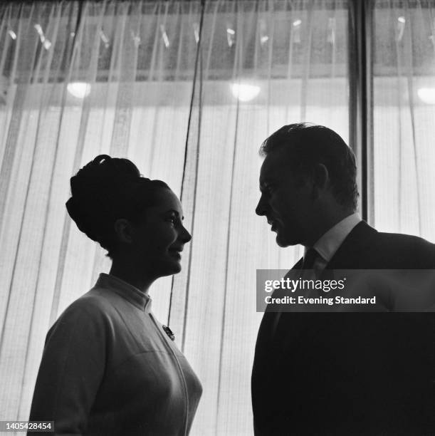 British-American actress Elizabeth Taylor and British actor Richard Burton on the set of 'The VIPs,' at MGM British Studios in Borehamwood,...