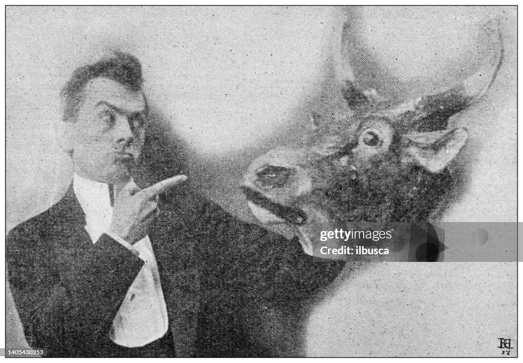 Antique photo: Actor with cow/bull mask