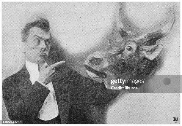 antique photo: actor with cow/bull mask - black and white cow stock illustrations