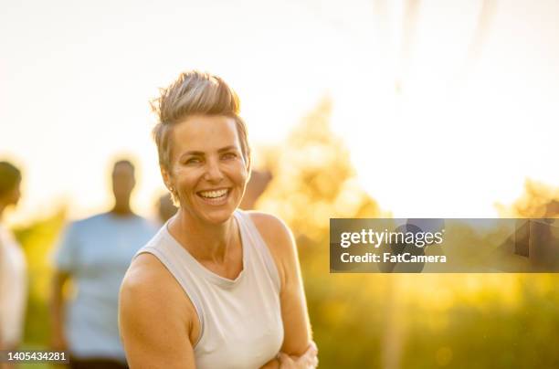 woman outdoors after a run - mixed race woman stockfoto's en -beelden