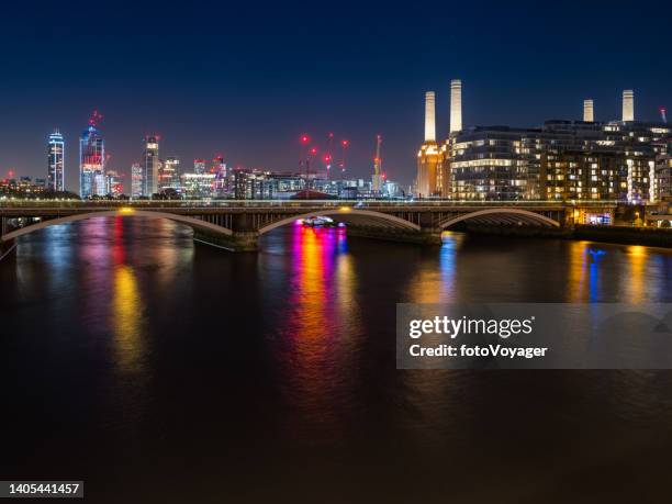 london battersea power station nine elms illuminated over thames night - battersea stock pictures, royalty-free photos & images