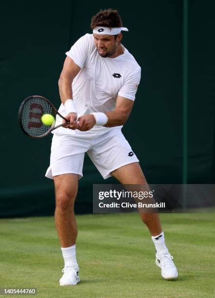 Jiri Vesely of Czech Republic plays a backhand against Federico Coria of Argentina during the Men's Singles First Round match during Day One of The...