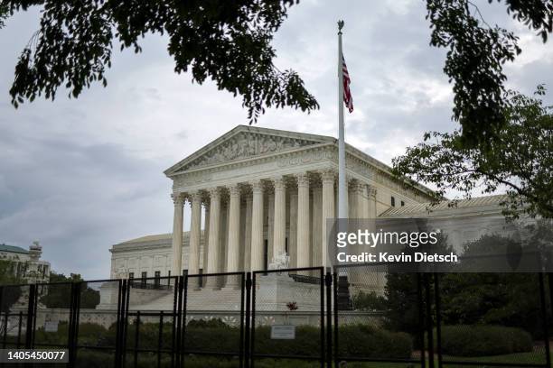 Fencing surrounds the U.S. Supreme Court as it nears the end of its term, June 27, 2022 in Washington, DC. The Supreme Court released three opinions,...