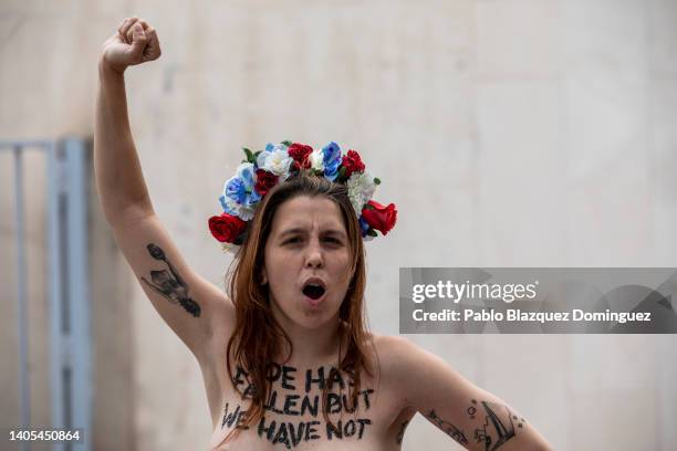 Activist rises her fist as she demonstrates outside the US Embassy against the US Supreme Court decision to overturn abortion rights on June 27, 2022...