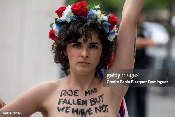 Activist with body paint reading 'Roe has fallen but we have not' protests outside the US Embassy against the US Supreme Court decision to overturn...
