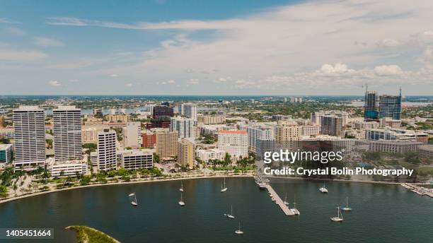 aerial drone view of the waterfront inlet in downtown west palm beach, florida & palm beach island at midday in june 2022 - west palm beach stock pictures, royalty-free photos & images