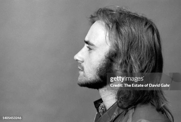 English drummer, singer-songwriter, record producer, and actor Phil Collins, lead singer of the English rock band Genesis, poses for a portrait circa...