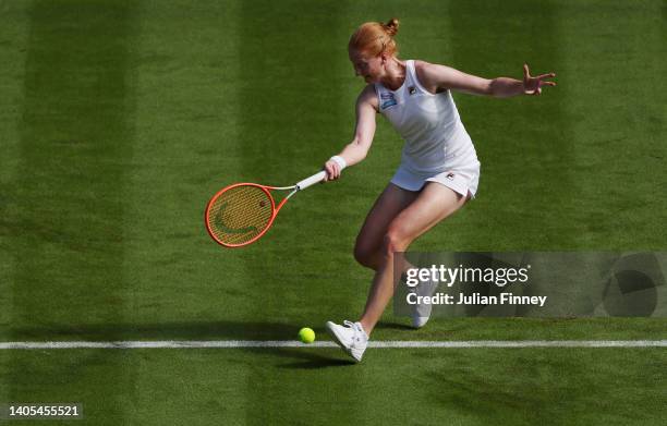 Alison Van Uytvanck of Belgium plays a forehand against Emma Raducanu of Great Britain the Women's Singles First Round match during Day One of The...