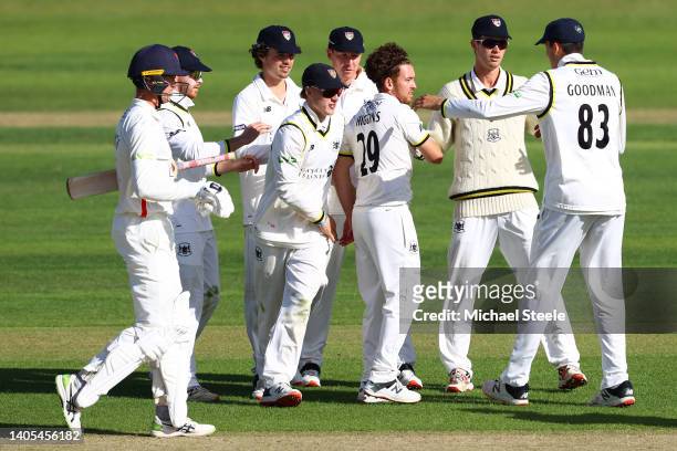 Ryan Higgins of Gloucestershire is congratulated by team mates after capturing the wicket of Keaton Jennings of Lancashire during day two of the LV=...