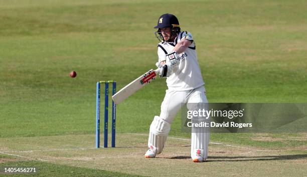 Alex Davies of Warwickshire plays the ball to the boundary during the LV= Insurance County Championship match between Northamptonshire and...