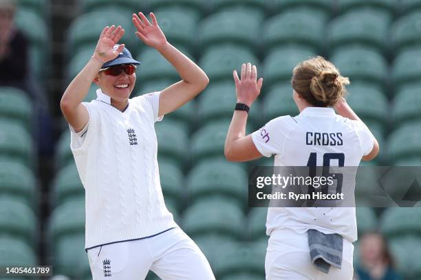 Issy Wong of England celebrates with teammates after catching out Sinalo Jafta of South Africa during Day One of the First Test Match between England...