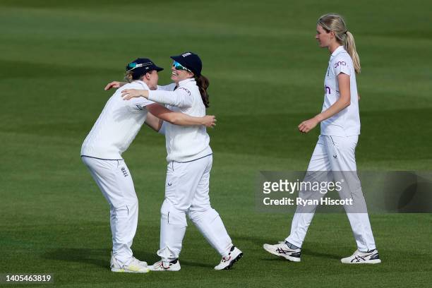Heather Knight embraces Tammy Beaumont of England as they celebrate after catching out Marizanne Kapp of South Africa with Lauren Bell during Day One...