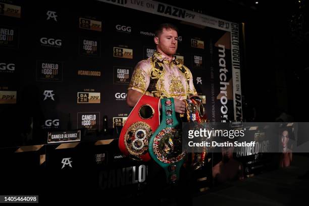 Canelo Alvarez poses with his championships belts after a press conference ahead of his fight with Gennady Golovkin on June 27, 2022 in New York City.