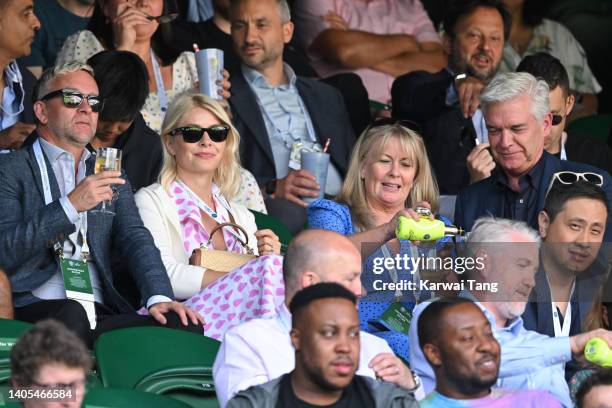 Daniel Baldwin, Holly Willoughby, Stephanie Lowe and Phillip Schofield attend day one of the Wimbledon Tennis Championships at the All England Lawn...