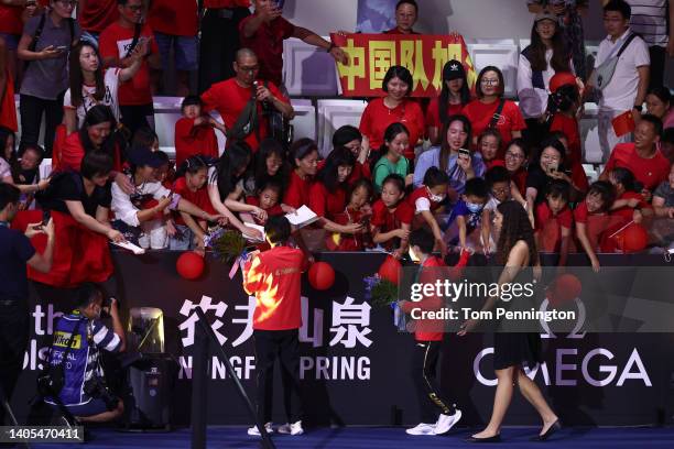 Gold medalist, Yuxi Chen of Team China and Silver medalist, Hongchan Quan of Team China celebrate with fans after the medal ceremony for the Women's...