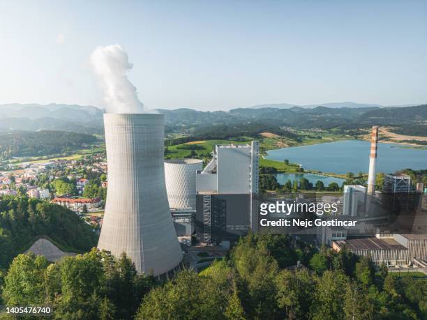 big coal power station with active cooling tower emitting gases into environment - carbon capture stock pictures, royalty-free photos & images