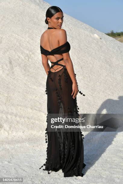 Tina Kunakey attends the "Le Papier " Jacquemus' Fashion Show on June 27, 2022 in Arles, France.