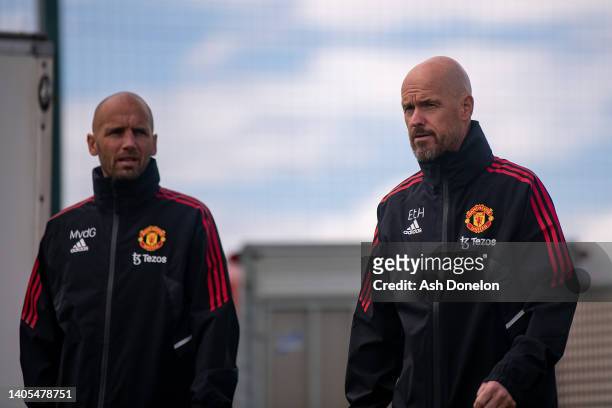 Coach Mitchell van der Gaag and Manager Erik ten Hag of Manchester United in action during a first team training session at Carrington Training...