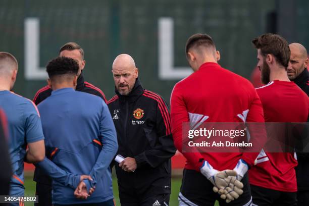 Manager Erik ten Hag of Manchester United talks to players during a first team training session at Carrington Training Ground on June 27, 2022 in...