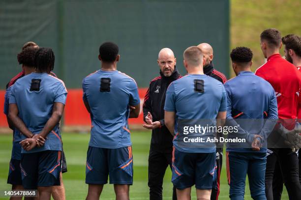 Manager Erik ten Hag of Manchester United talks to players during a first team training session at Carrington Training Ground on June 27, 2022 in...