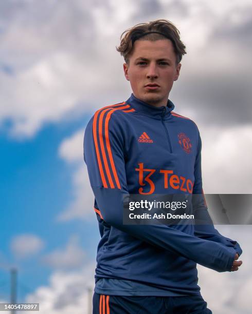 Charlie Savage of Manchester United in action during a first team training session at Carrington Training Ground on June 27, 2022 in Manchester,...